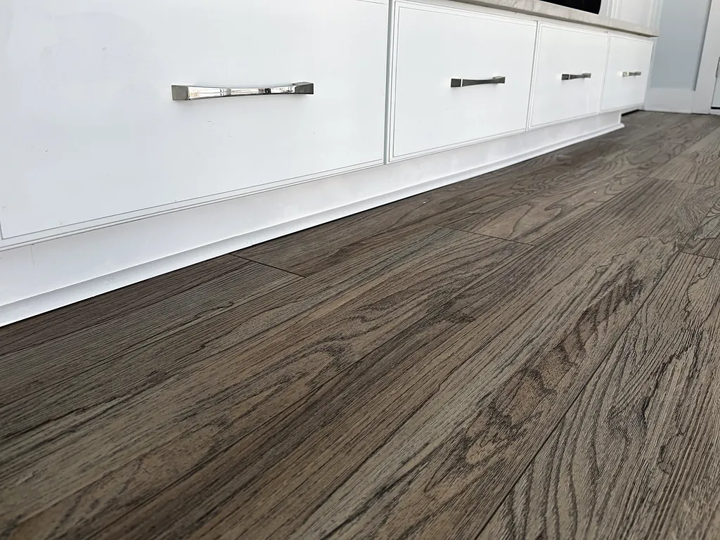 The same built-in drawers finished in white with a clean line along the floor