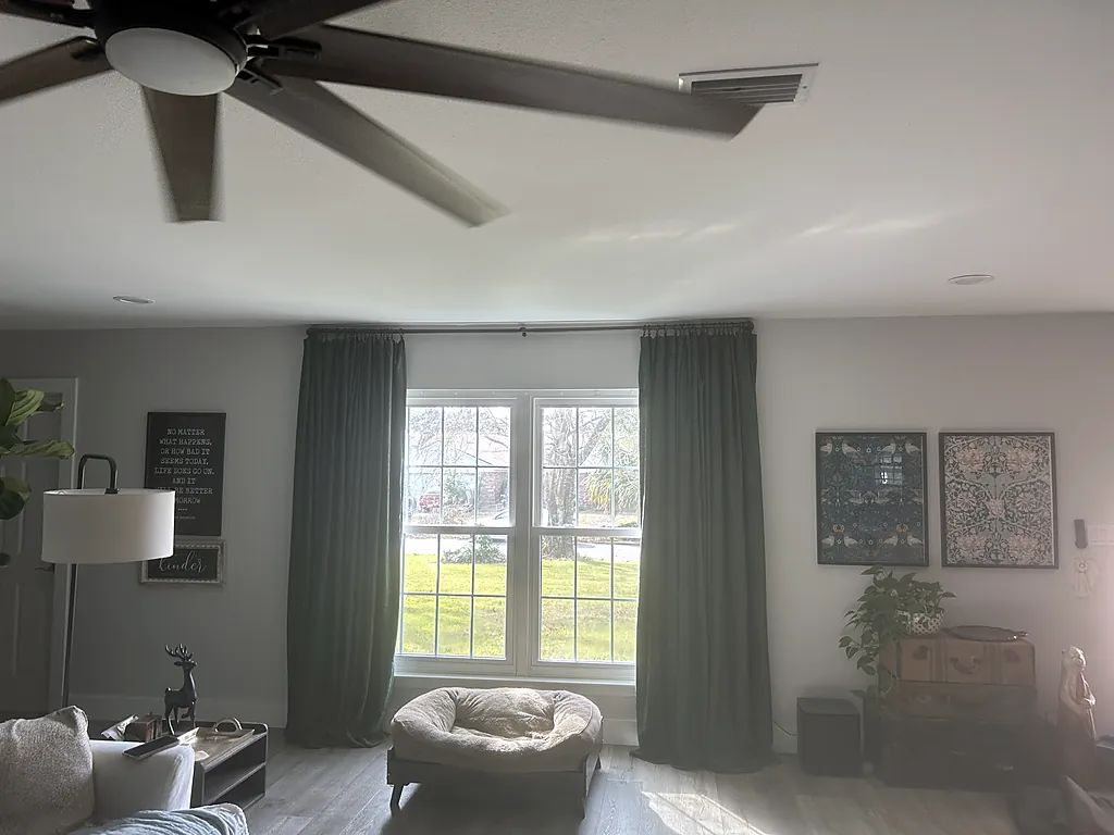 Repainted living room with a window, curtains and painted walls in Destin, Florida